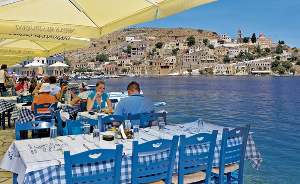 Dining on the waterfront in the Greek island of Simi 
