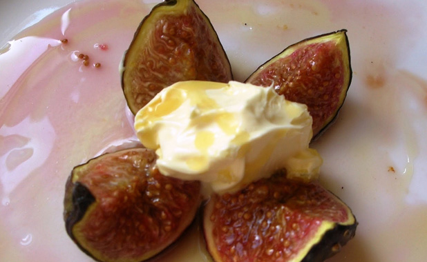 Fig with clotted cream and drizzled with honey